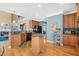 Gourmet kitchen with stainless appliances, granite countertops, hardwood floors, and a breakfast bar at 4613 Moores Creek Rd, Durham, NC 27705