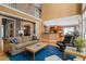 Spacious living room with hardwood floors, two-story ceilings, comfortable seating, and open access to the kitchen at 4613 Moores Creek Rd, Durham, NC 27705
