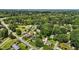 Aerial photograph of homes surrounded by lush trees within the surrounding area at 502 S Eighth St, Mebane, NC 27302