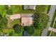 An aerial perspective of the property showing the home, yard, driveway, and surroundings at 502 S Eighth St, Mebane, NC 27302