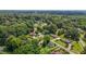 A captivating aerial showing the neighborhood with mature trees and charming homes at 502 S Eighth St, Mebane, NC 27302