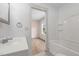 Bathroom view into an adjacent bedroom highlighting modern fixtures and finishes at 502 S Eighth St, Mebane, NC 27302