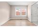 Bright bedroom with light filled window and ensuite bathroom featuring modern flooring at 502 S Eighth St, Mebane, NC 27302