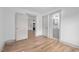 Open layout bedroom with hardwood floors, leading to bathroom and kitchen at 502 S Eighth St, Mebane, NC 27302
