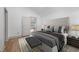 Spacious bedroom showcasing neutral tones, a padded headboard, and ample natural light at 502 S Eighth St, Mebane, NC 27302