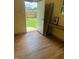 The interior of the garage features laminate flooring and a view to the backyard at 502 S Eighth St, Mebane, NC 27302