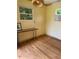 The interior of the garage features laminate flooring and a window air conditioner at 502 S Eighth St, Mebane, NC 27302