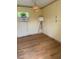 The interior of the garage features laminate flooring and a window air conditioner at 502 S Eighth St, Mebane, NC 27302