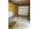 Inside the garage, featuring a white garage door and stained concrete floor at 502 S Eighth St, Mebane, NC 27302