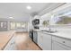 Well-lit kitchen features stainless steel appliances, marble countertops, and a cozy atmosphere perfect for cooking and entertaining at 502 S Eighth St, Mebane, NC 27302