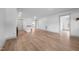 Large living room with neutral walls, light wood flooring, and an open layout at 502 S Eighth St, Mebane, NC 27302