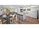 Open-concept living space featuring a modern kitchen, dining area, and comfortable living room, perfect for entertaining guests at 502 S Eighth St, Mebane, NC 27302