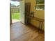 Bright sunroom with hardwood floors and a door leading to the backyard at 502 S Eighth St, Mebane, NC 27302