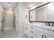 Modern bathroom with double vanity, framed mirror, and glass-enclosed shower at 513 Brooks St, Wake Forest, NC 27587