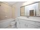 Bathroom with vanity, framed mirror, tub shower combination and tile flooring at 513 Brooks St, Wake Forest, NC 27587