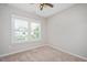 Bedroom with ceiling fan, a window with bright light and plantation shutters at 513 Brooks St, Wake Forest, NC 27587