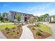 Beautiful neighborhood offers sidewalks, landscaping, curb appeal, and unique townhome design at 513 Brooks St, Wake Forest, NC 27587
