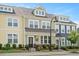 Charming townhouse featuring colorful exteriors, well-manicured landscaping, and inviting front entrances at 513 Brooks St, Wake Forest, NC 27587