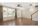 Sunlit living room boasting hardwood floors, plantation shutters, and neutral paint at 513 Brooks St, Wake Forest, NC 27587
