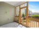 Screened-in porch with open view of greenery offers privacy and fresh air at 513 Brooks St, Wake Forest, NC 27587