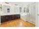 Bright bathroom with a double sink vanity, a large tub, and a glass enclosed shower at 613 Penncross Dr, Raleigh, NC 27610
