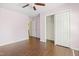 Bedroom with wood floors and a sliding closet door at 613 Penncross Dr, Raleigh, NC 27610
