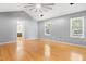 Bedroom featuring natural light, ceiling fan, and wood floors at 613 Penncross Dr, Raleigh, NC 27610