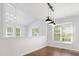 A dining area featuring hardwood floors, white walls, pendant lighting, and natural light at 613 Penncross Dr, Raleigh, NC 27610