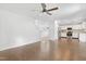 Living room area features wood-look floors and an open layout connected to the kitchen and dining area at 613 Penncross Dr, Raleigh, NC 27610