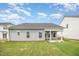 Backyard view of a home with a covered patio and light gray vinyl siding at 66 W Emily Gardens Dr, Selma, NC 27576