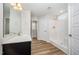 Bright bathroom features a walk-in shower, a vanity with a sink, and modern fixtures for a spa-like experience at 66 W Emily Gardens Dr, Selma, NC 27576