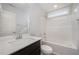 Clean bathroom featuring white fixtures and a tub shower combo at 66 W Emily Gardens Dr, Selma, NC 27576