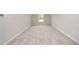 Bright bedroom with neutral carpet and a window providing natural light at 66 W Emily Gardens Dr, Selma, NC 27576