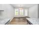 Dining area with hardwood floors, chandelier, and a door that opens to the backyard at 66 W Emily Gardens Dr, Selma, NC 27576