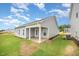 The exterior showcases a covered patio, siding, and a well-maintained lawn at 66 W Emily Gardens Dr, Selma, NC 27576