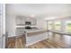 Kitchen with a gray island, granite countertops, and stainless steel appliances at 66 W Emily Gardens Dr, Selma, NC 27576
