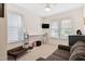 Cozy bedroom with natural light, a comfortable couch, and a dedicated workspace at 6928 Leesville Rd, Raleigh, NC 27613