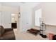 Relaxing bedroom features a comfortable couch, natural light, and space for pets to relax at 6928 Leesville Rd, Raleigh, NC 27613