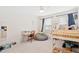 Bright bedroom with a bunk bed, desk, chair, and beanbag chair at 6928 Leesville Rd, Raleigh, NC 27613