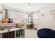 Bright bedroom with a fan, built-in bed, and desk and chair at 6928 Leesville Rd, Raleigh, NC 27613