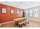 Inviting dining room with rustic wooden table, unique wall decor, and ample natural light at 6928 Leesville Rd, Raleigh, NC 27613