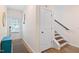 Inviting entryway boasts a stylish rug and easy access to the stairway at 6928 Leesville Rd, Raleigh, NC 27613