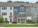 Charming townhome with a combination of siding and brick, covered porch, and well-maintained lawn at 6928 Leesville Rd, Raleigh, NC 27613