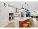 Well-lit kitchen featuring a spacious island, stainless steel appliances, and contemporary design at 6928 Leesville Rd, Raleigh, NC 27613