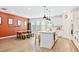 Open concept kitchen features modern island, stainless steel appliances, and dining area for easy entertaining at 6928 Leesville Rd, Raleigh, NC 27613