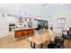 Bright kitchen boasts a large island with seating, stainless steel appliances, and a seamless flow to the living area at 6928 Leesville Rd, Raleigh, NC 27613