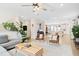 Open-concept living space with a view of the kitchen, stylish furniture, and ample natural light at 6928 Leesville Rd, Raleigh, NC 27613