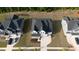 Aerial view of the house, showing the roof, driveway, and neighboring houses at 713 Ramsours Mill Dr, Holly Springs, NC 27540