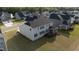 Aerial view of the home's backyard and back exterior, deck, and screened-in porch at 713 Ramsours Mill Dr, Holly Springs, NC 27540