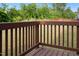 A close up shot of the railings and wooden floor of the home's back deck at 713 Ramsours Mill Dr, Holly Springs, NC 27540